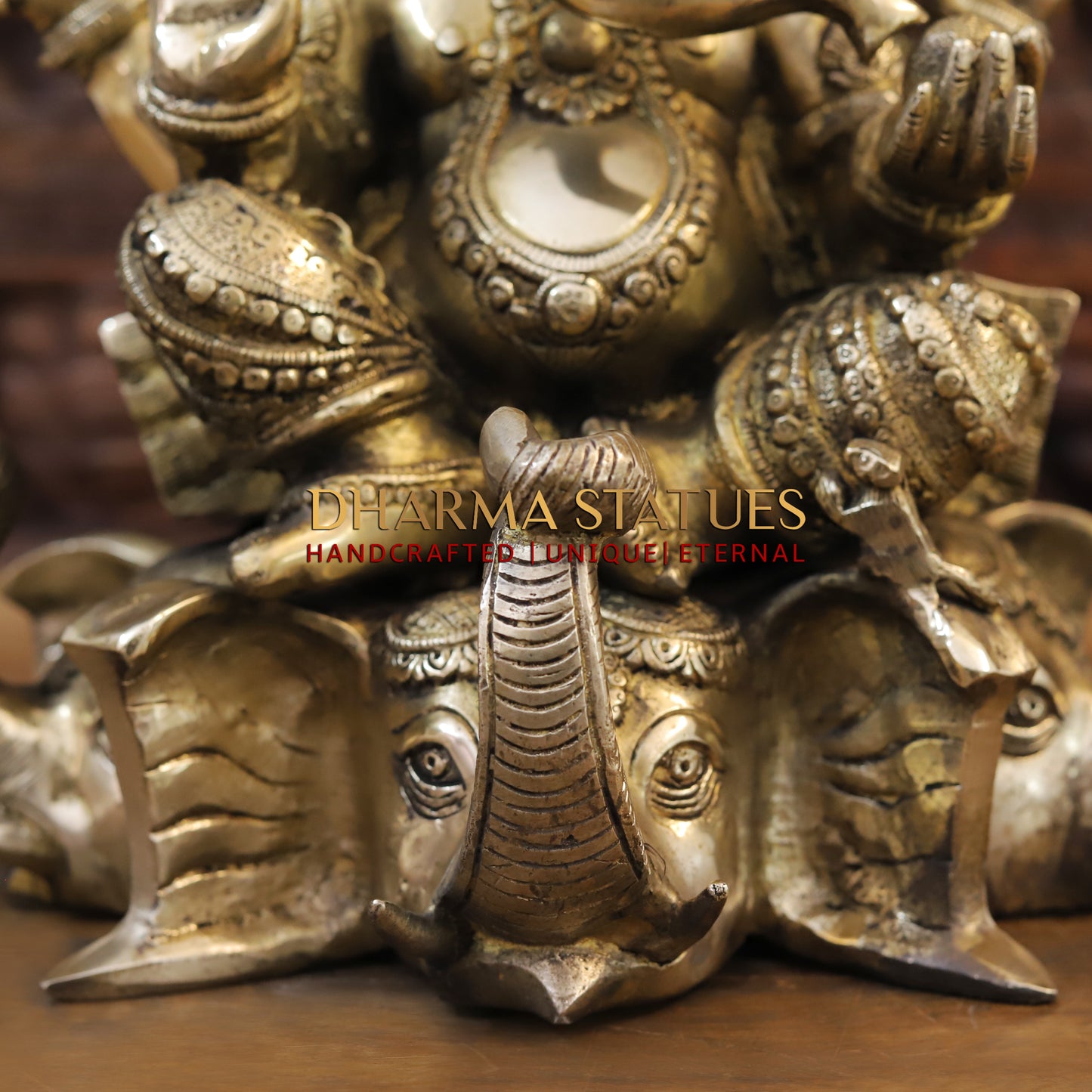 Brass Ganesh seated on Elephant Base, Fine Golden Finish, 16.5"