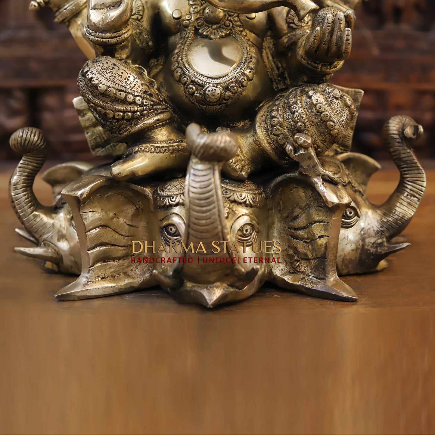 Brass Ganesh seated on Elephant Base, Fine Golden Finish, 16.5"