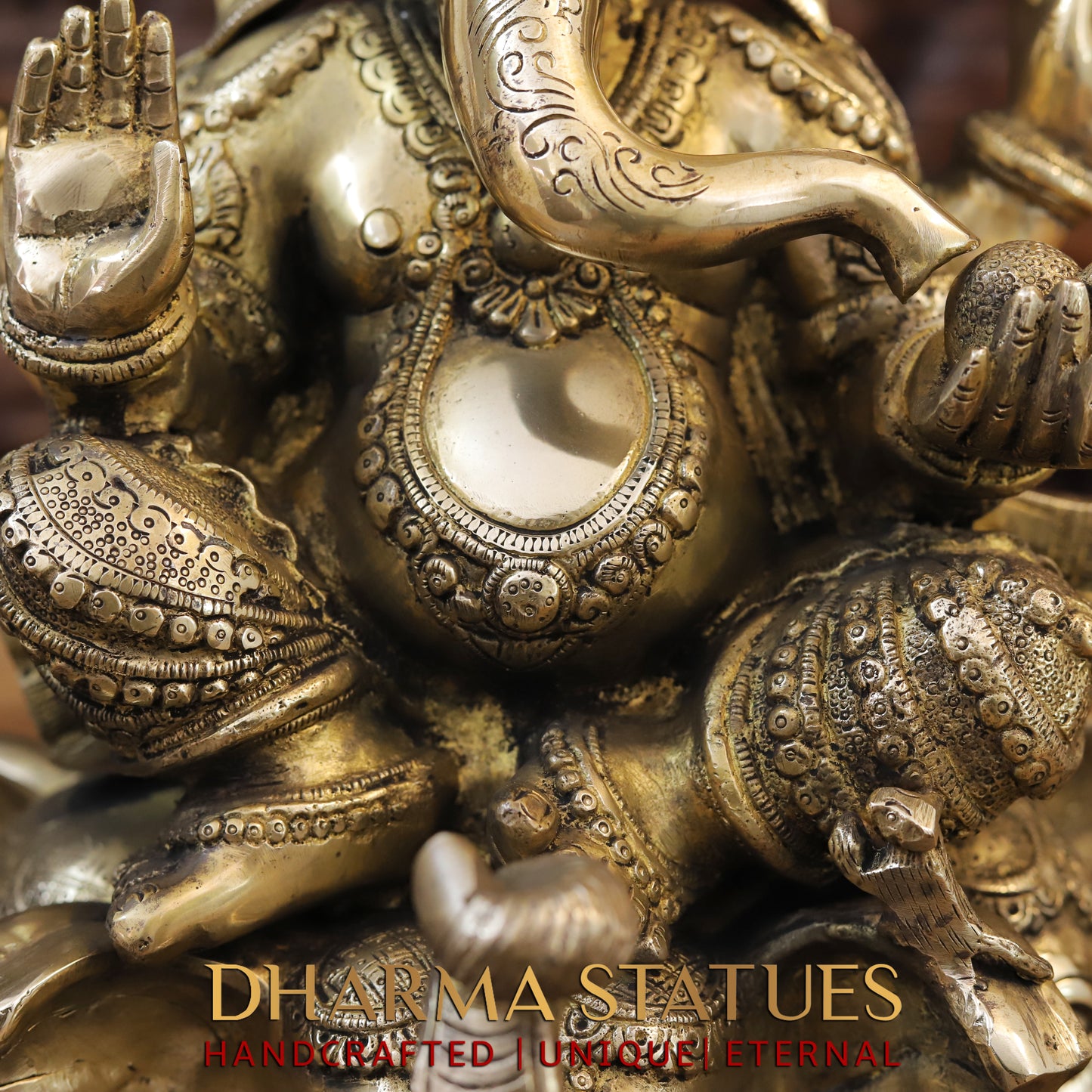 Brass Ganesh seated on Elephant Base, Fine Golden Finish, 16.5"