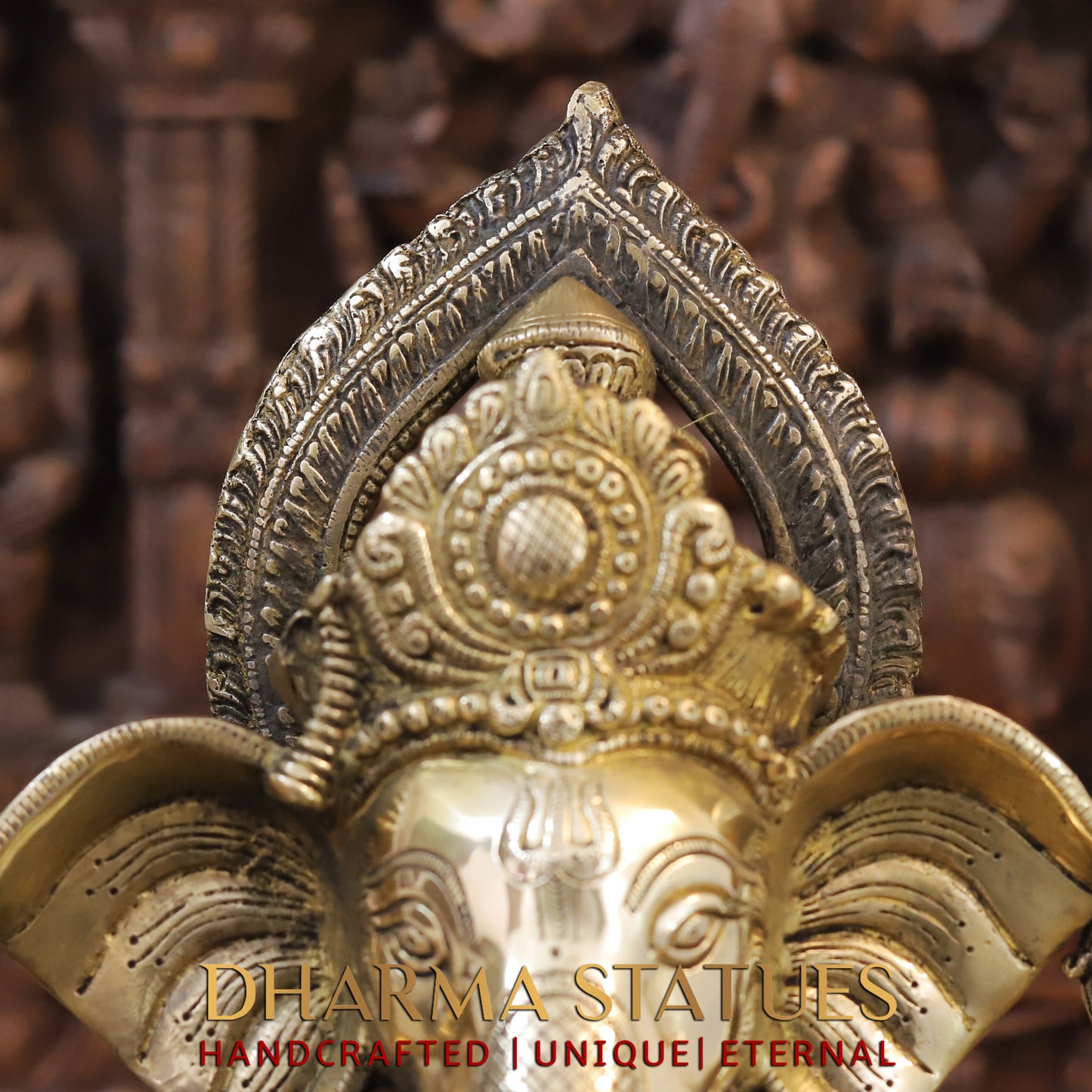Brass Ganesh seated on Elephant Base, Fine Golden Finish, 16.5"