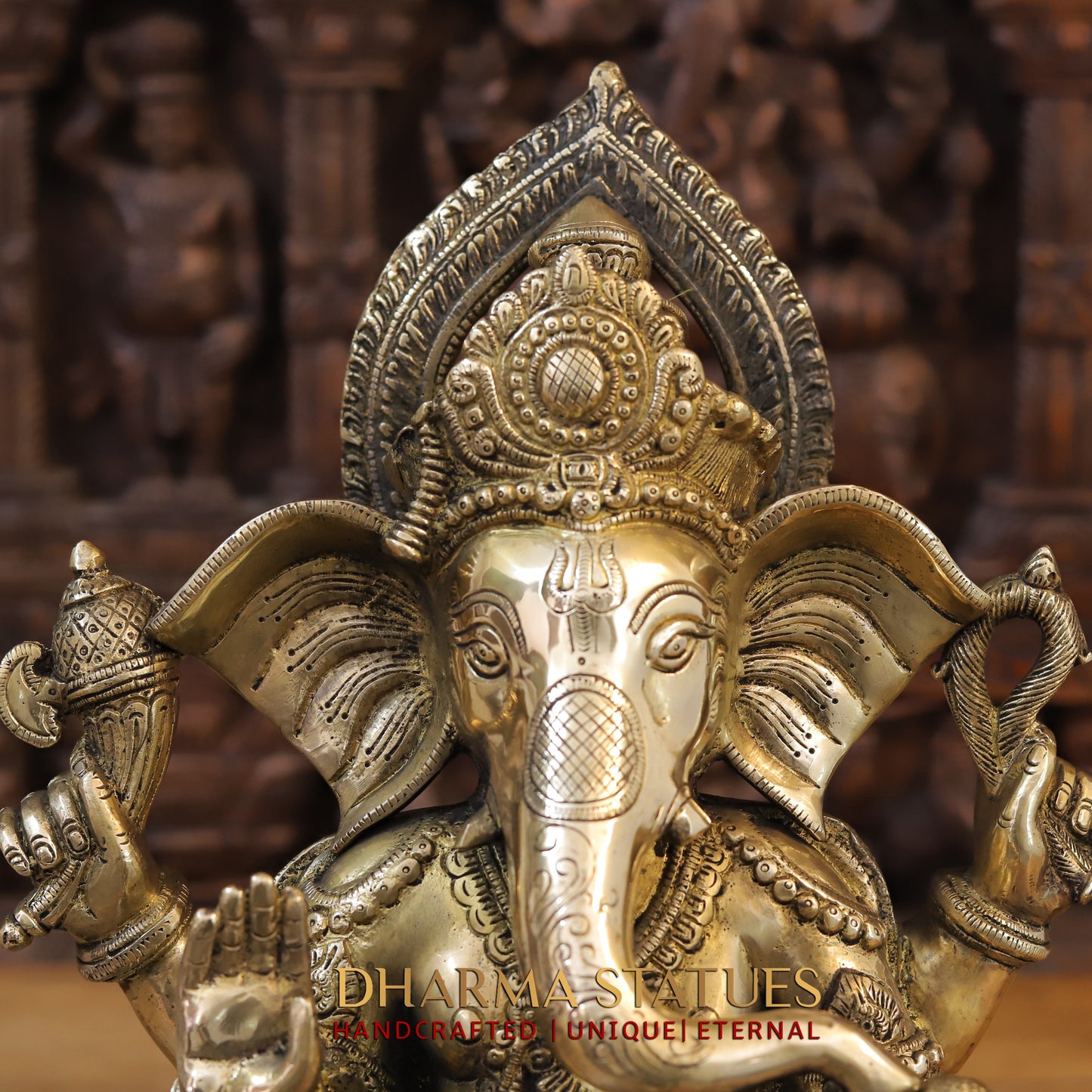 Brass Ganesh seated on Elephant Base, Fine Golden Finish, 16.5"
