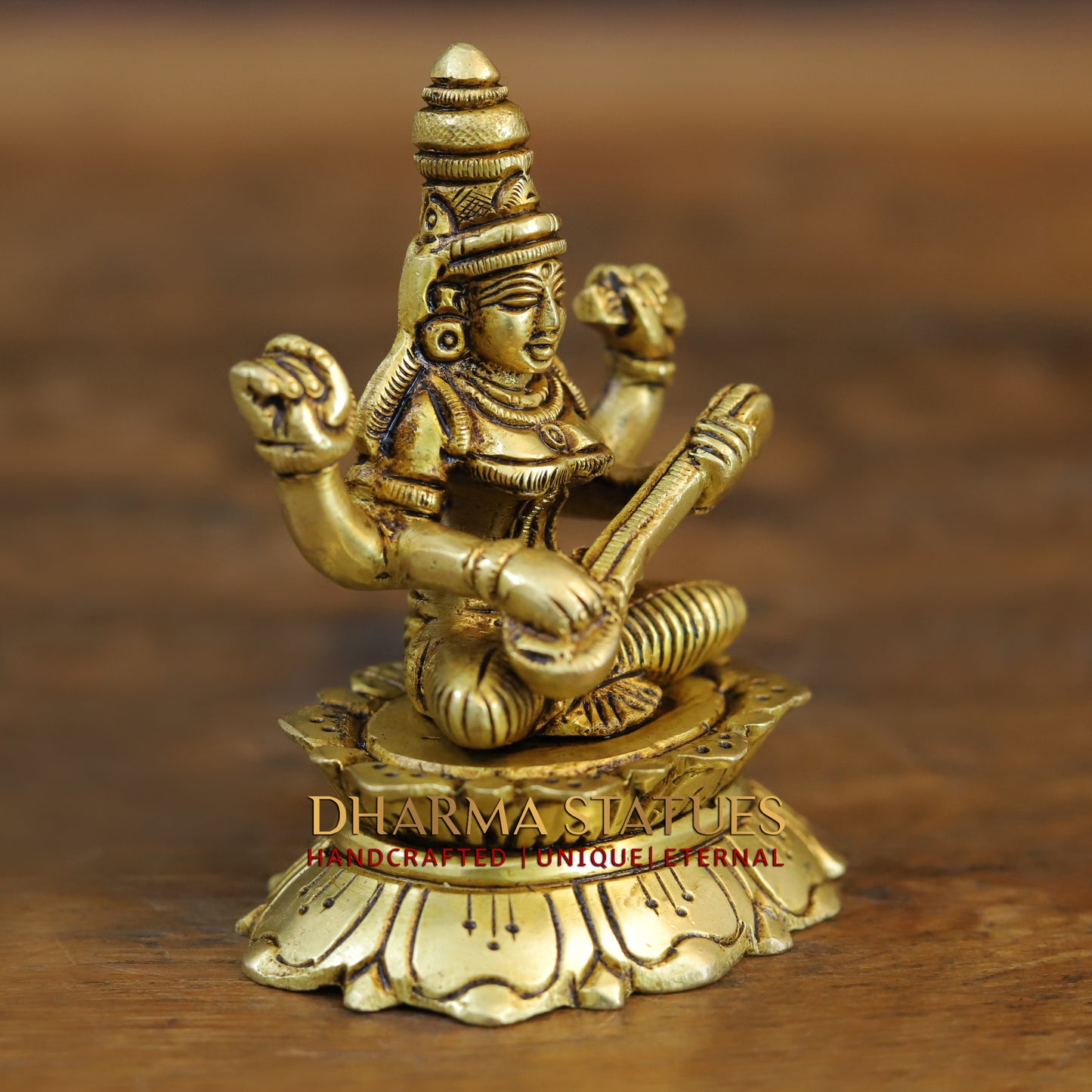 Brass Saraswati, Lakshmi and Ganesh seated on a Lotus, Golden Finish, 3.5"