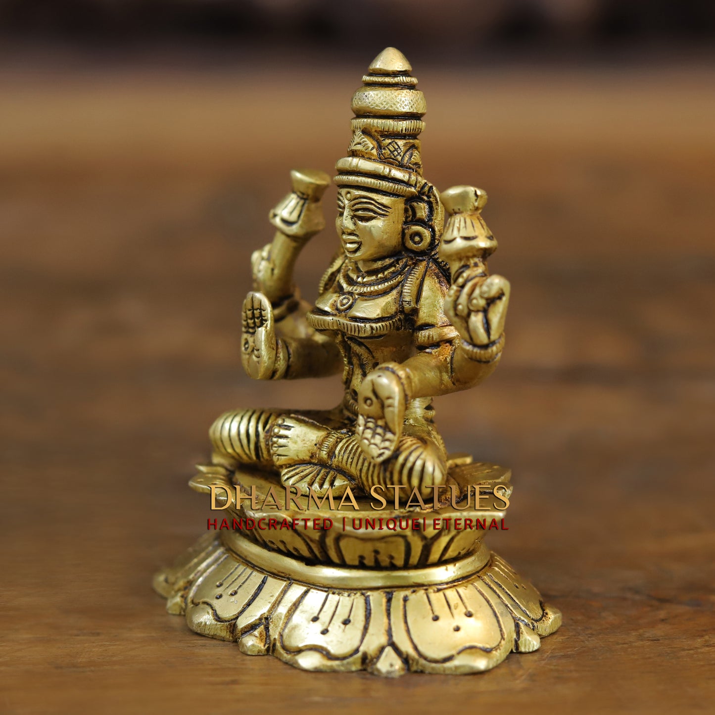 Brass Saraswati, Lakshmi and Ganesh seated on a Lotus, Golden Finish, 3.5"