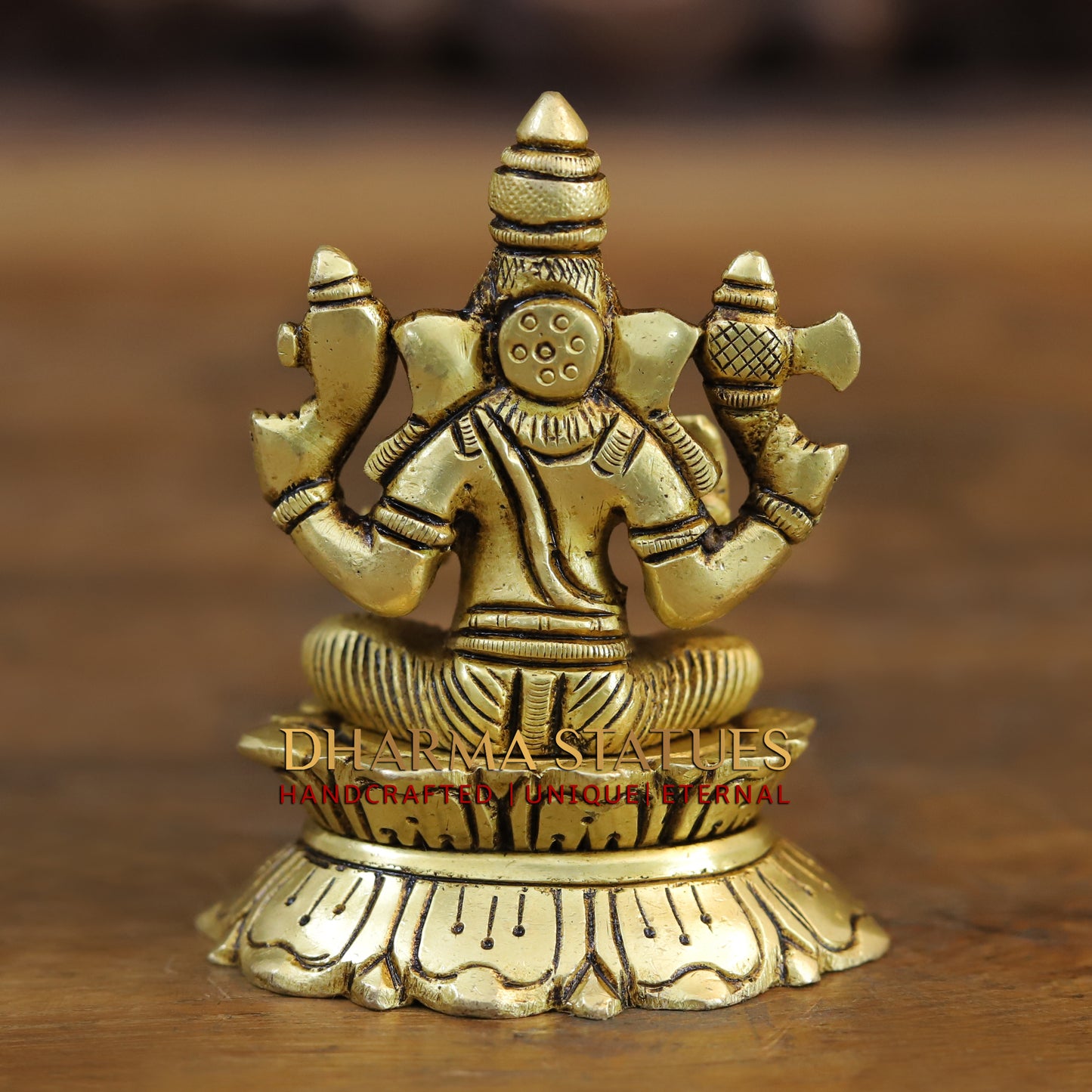Brass Saraswati, Lakshmi and Ganesh seated on a Lotus, Golden Finish, 3.5"