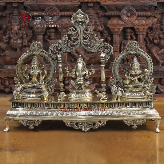 brass ganesh, lakshmi, and saraswati idols