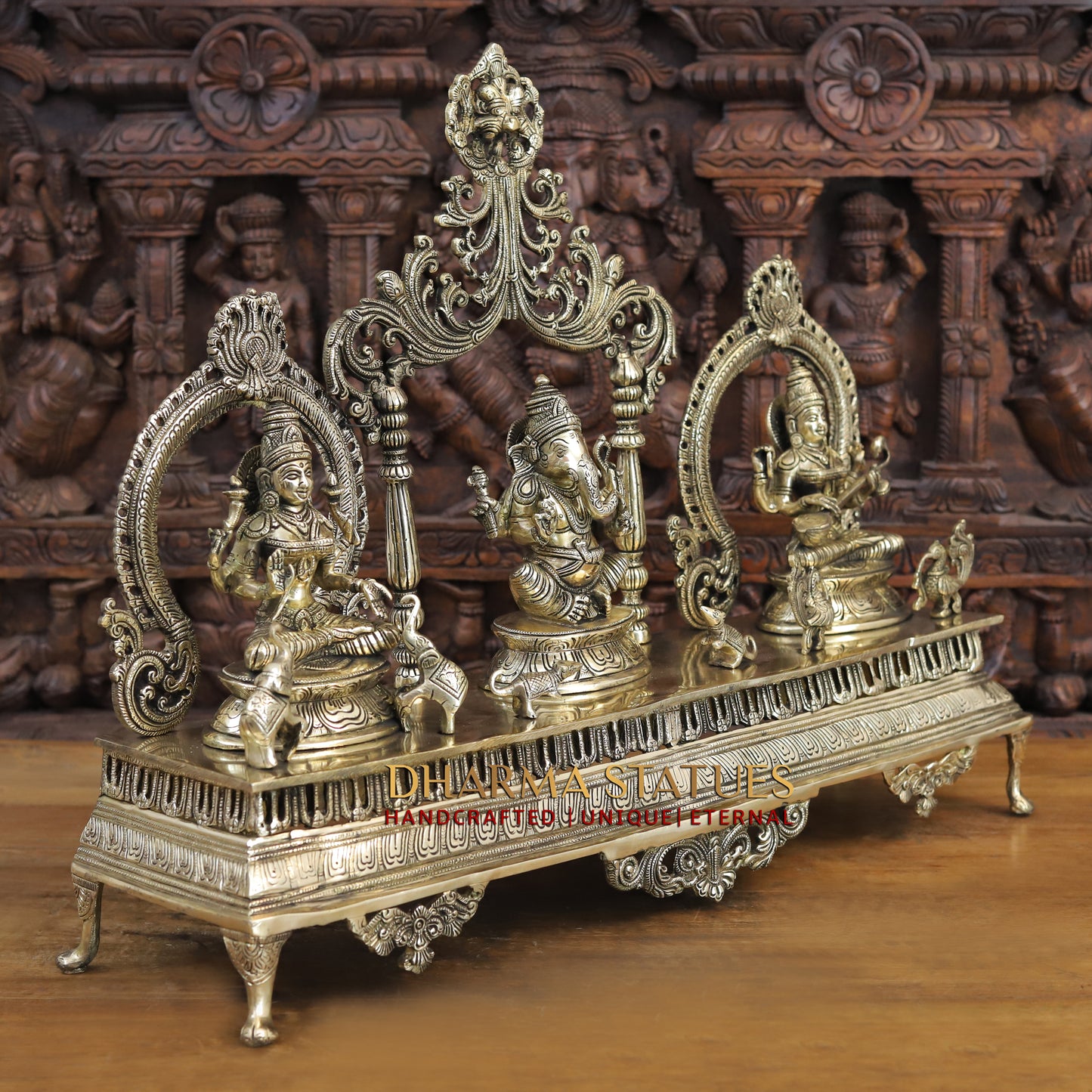 brass ganesh, lakshmi, and saraswati idols