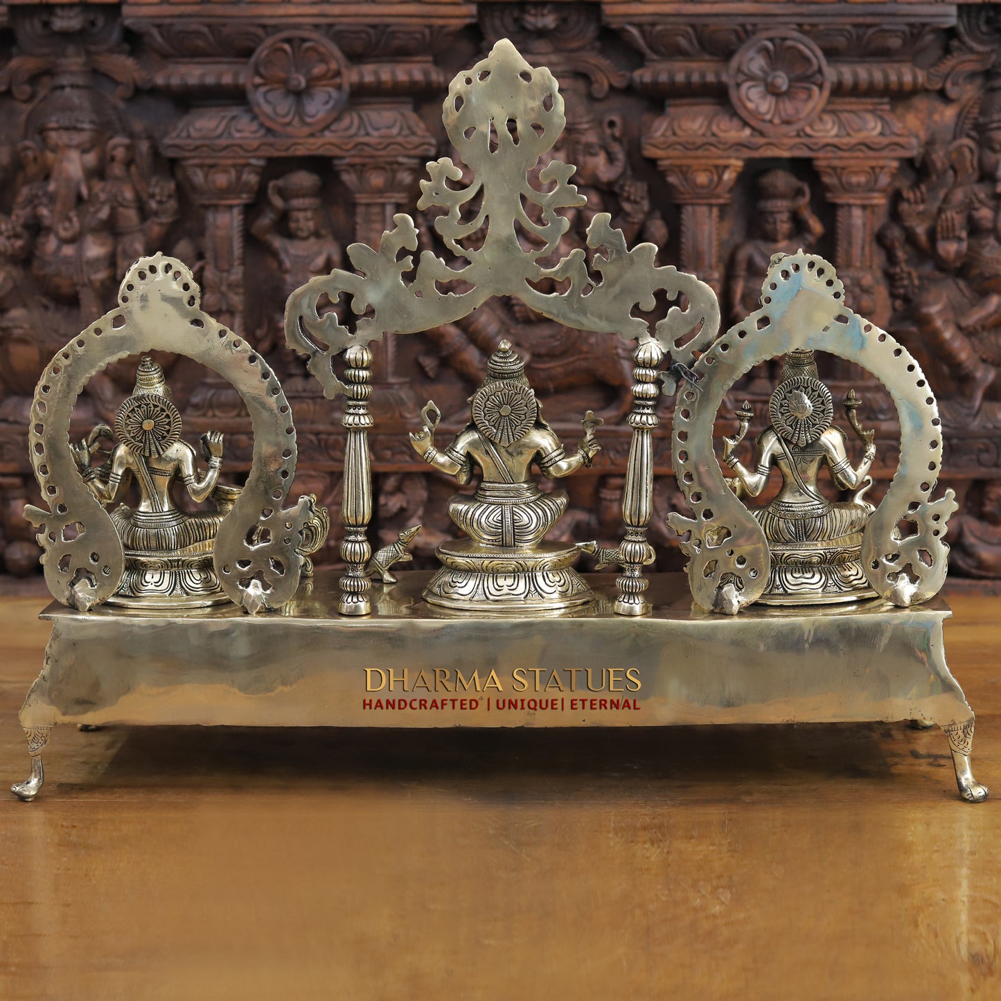 brass ganesh, lakshmi, and saraswati idols