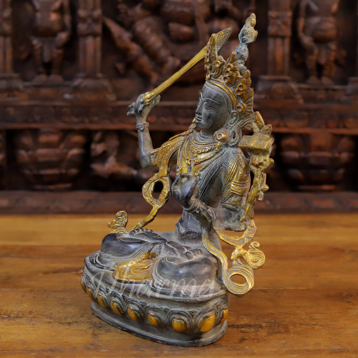 Brass Tara Idol, Seated on a Lotus, Holding a Sword, Black patina & Golden 12.5" side view