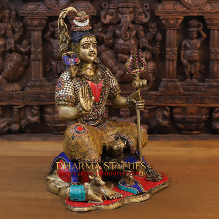 Brass Lord Shiva Idol, Seated on a lions skin, Golden and Stone work 18.5" side view