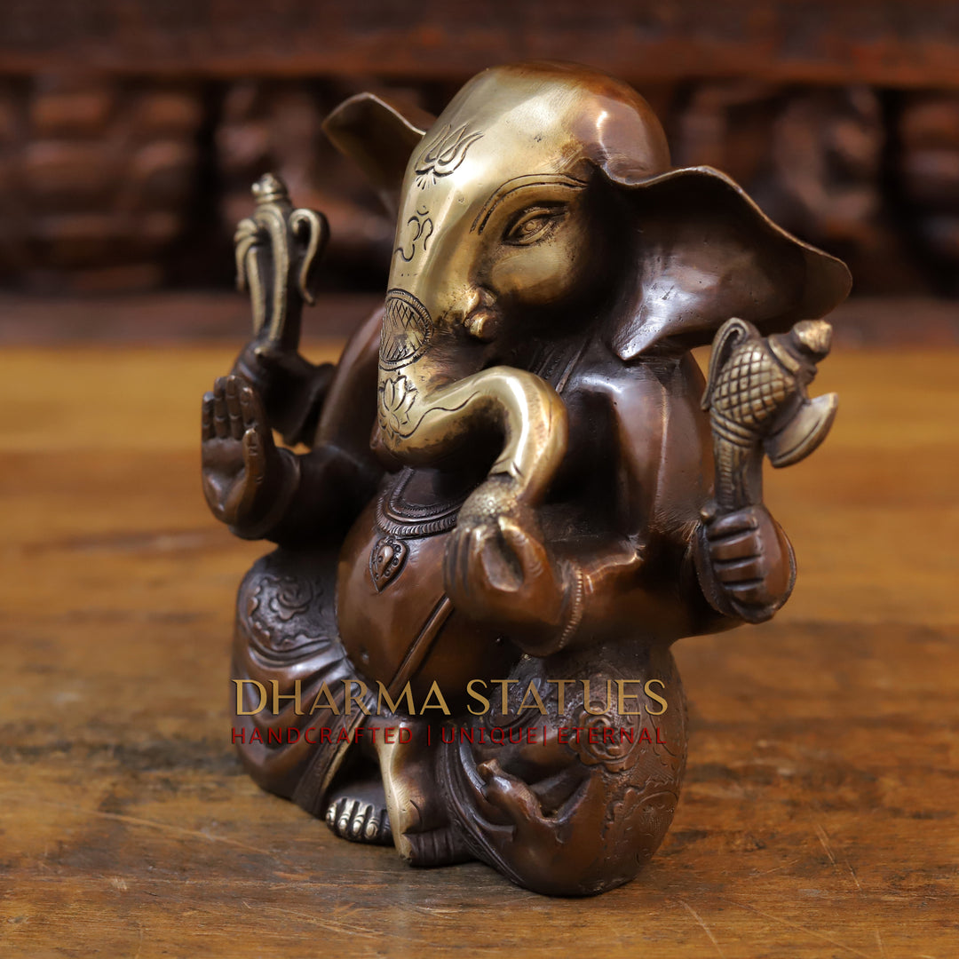 Brass Appu Ganesh seated, copper and gold 7.5”