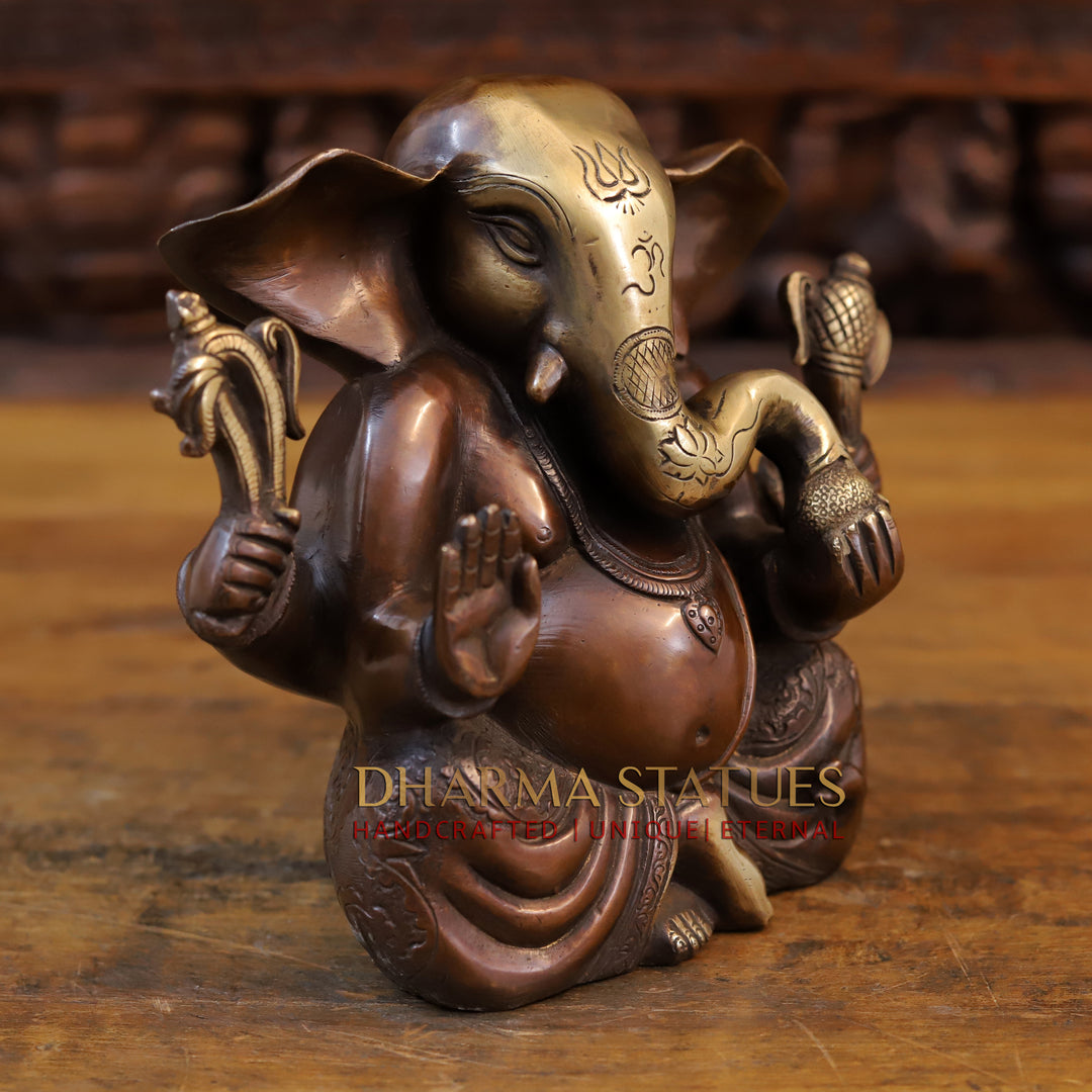 Brass Appu Ganesh seated, copper and gold 7.5”