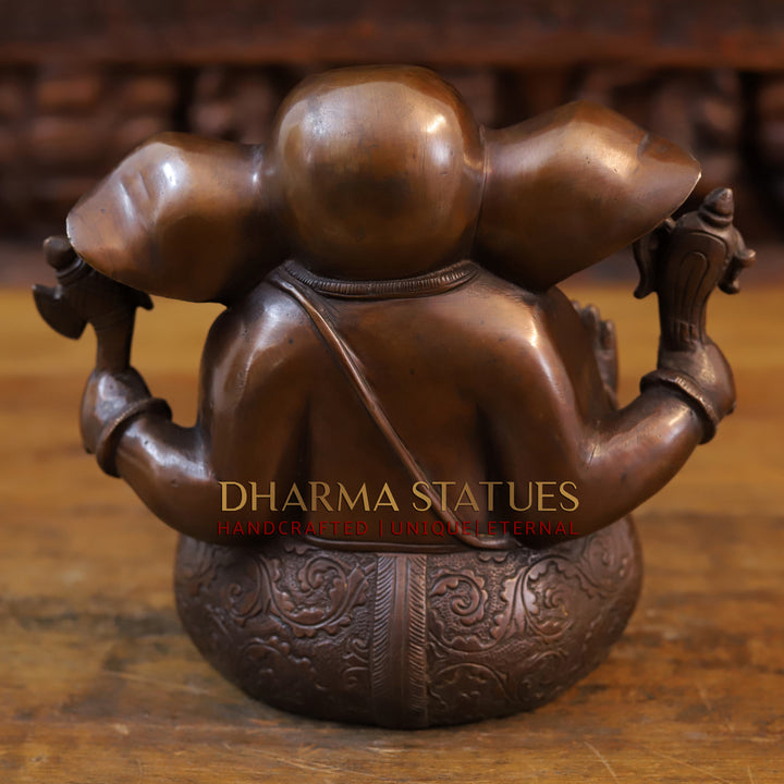 Brass Appu Ganesh seated, copper and gold 7.5”