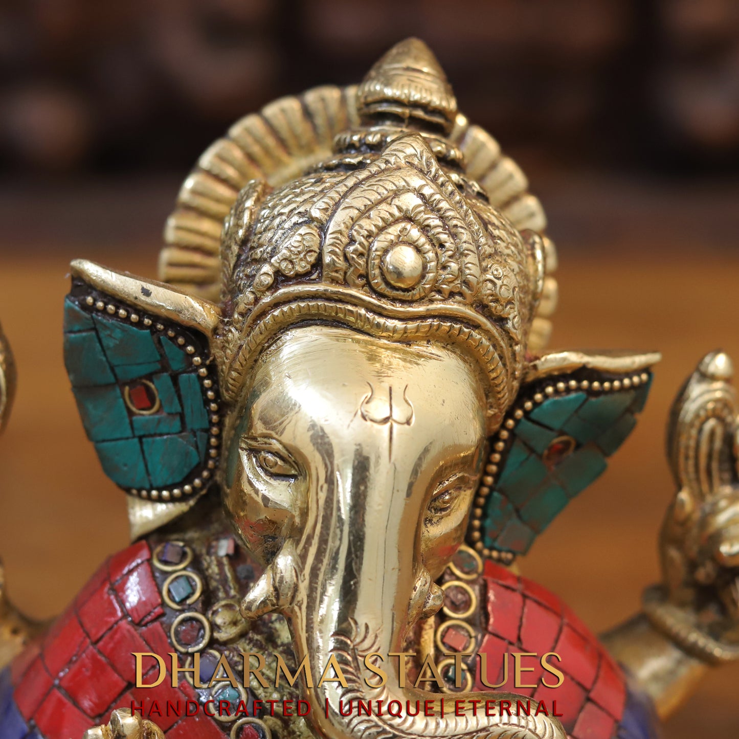 Brass Ganesh seated with tilted neck, Golden & Stone work, 7"