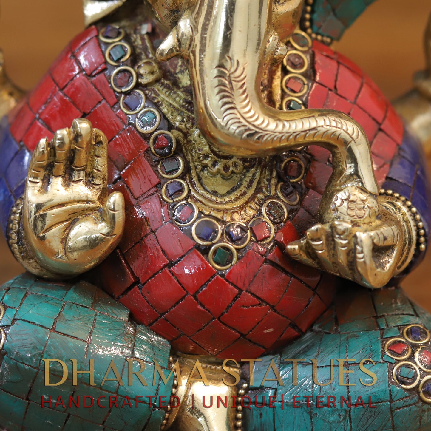 Brass Ganesh seated with tilted neck, Golden & Stone work, 7"