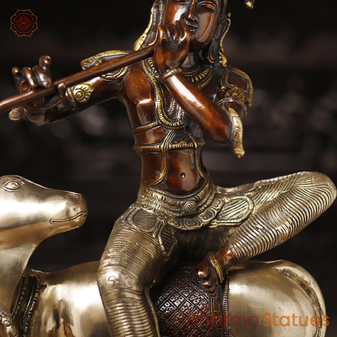 Brass Krishna Statue, Seated on a Cow, Golden & Copper Finish, 21"