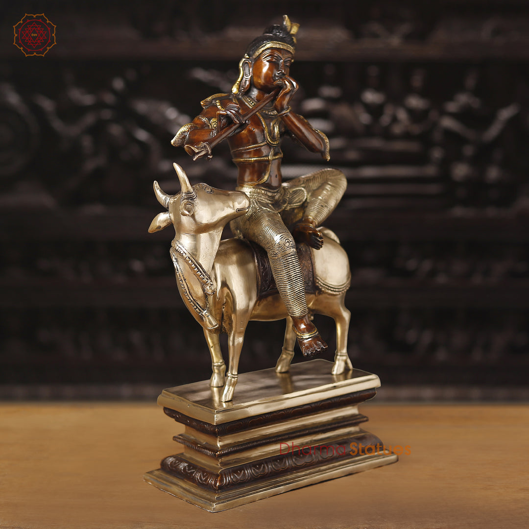 Brass Krishna Statue, Seated on a Cow, Golden & Copper Finish, 21"