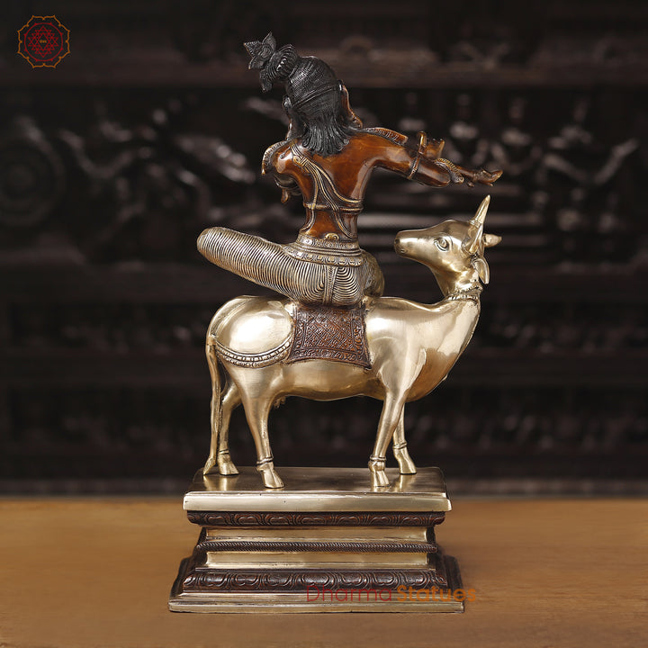 Brass Krishna Statue, Seated on a Cow, Golden & Copper Finish, 21"