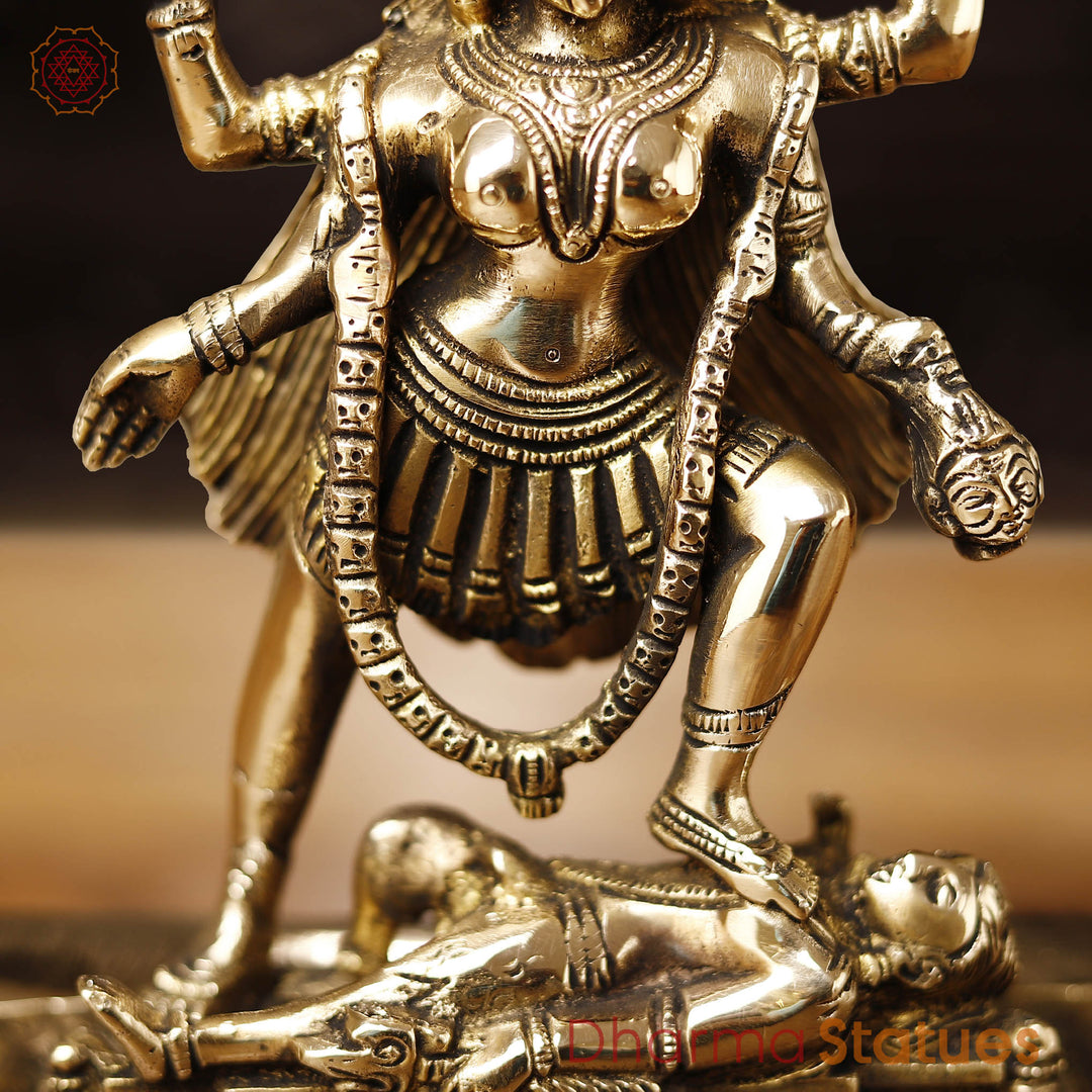 Brass Kali Idol- Goddess Kali Standing On Lord Shiva's Chest, Golden Finish 9"